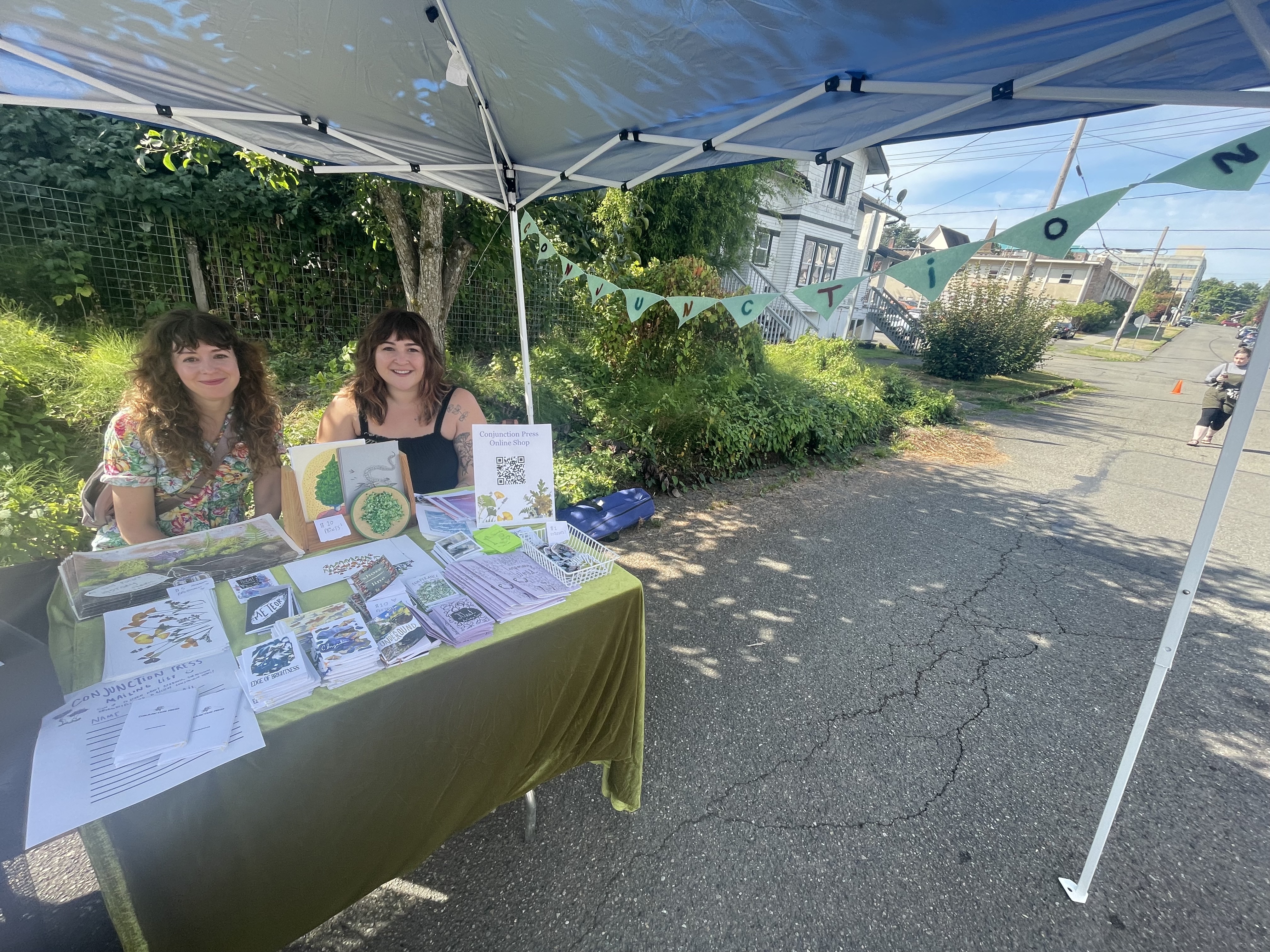 Carolyn and Karah selling zines at the Olympia Zine Fest